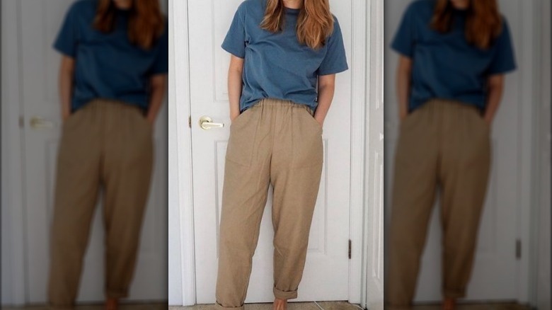 Woman blue t-shirt brown trousers