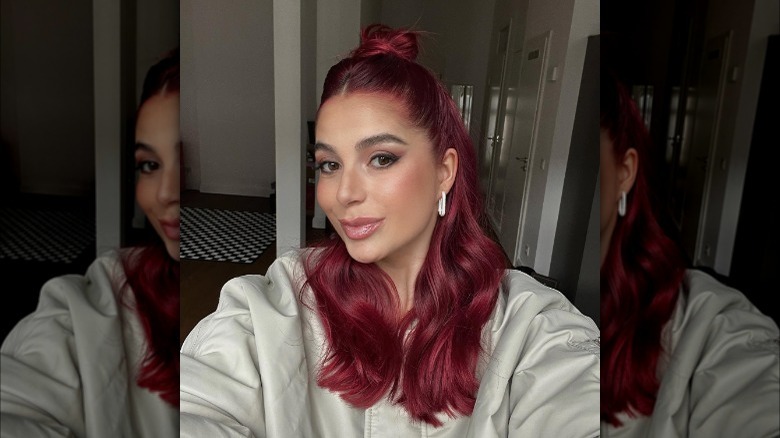 Redhead with half-up bun hairstyle