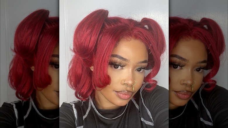 Redhead with half-up, half-down pigtails