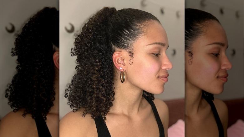 Woman with slicked back half-up ponytail