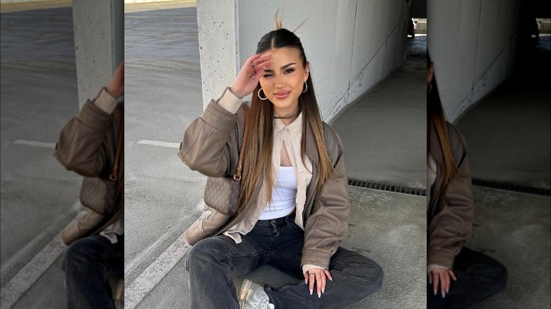 Brunette with half-up hair, spiky bun