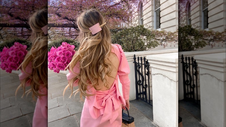 Blonde wearing hair half-up, barrette