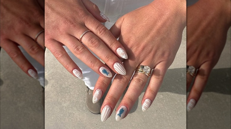 A neutral beachy nail art design.