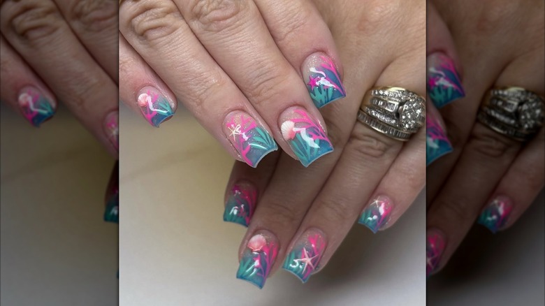 A coral reef-inspired nail art design.