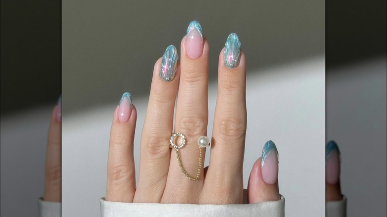 A holographic nail art design.