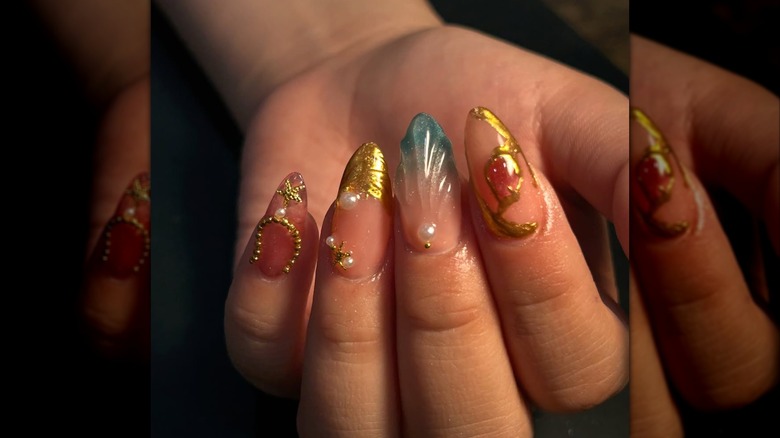 A mermaid-inspired nail art design.