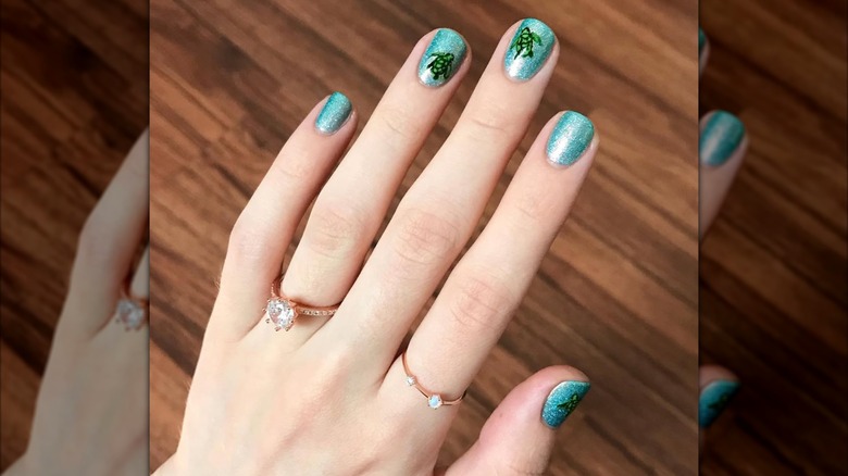 A turtle-inspired nail art design.