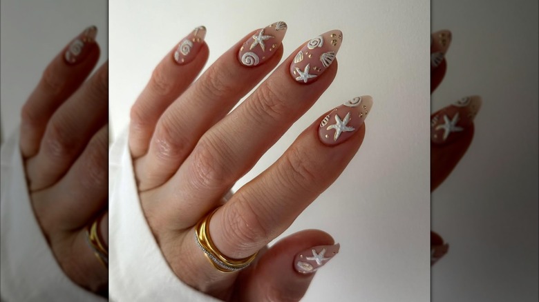 A white beach-inspired nail art design.