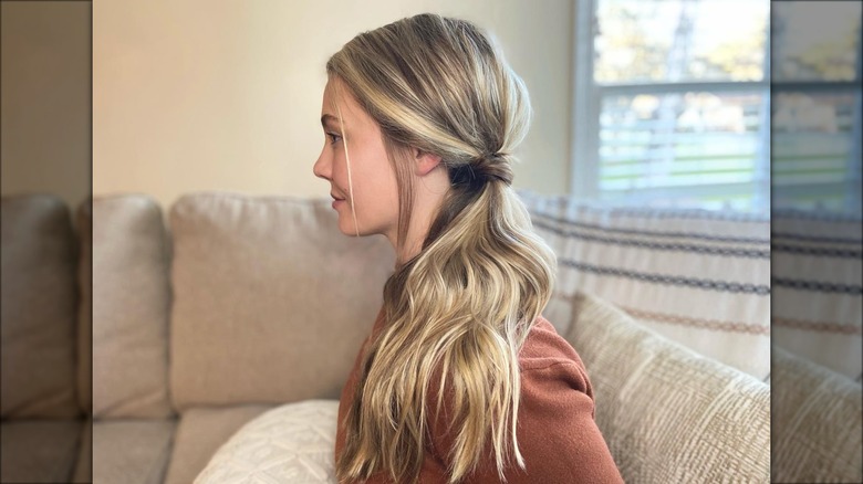 woman wearing wrapped side pony