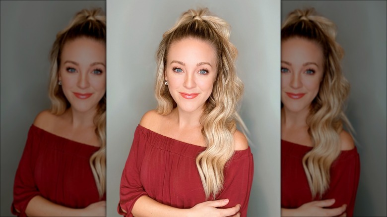 woman with half up wavy ponytail