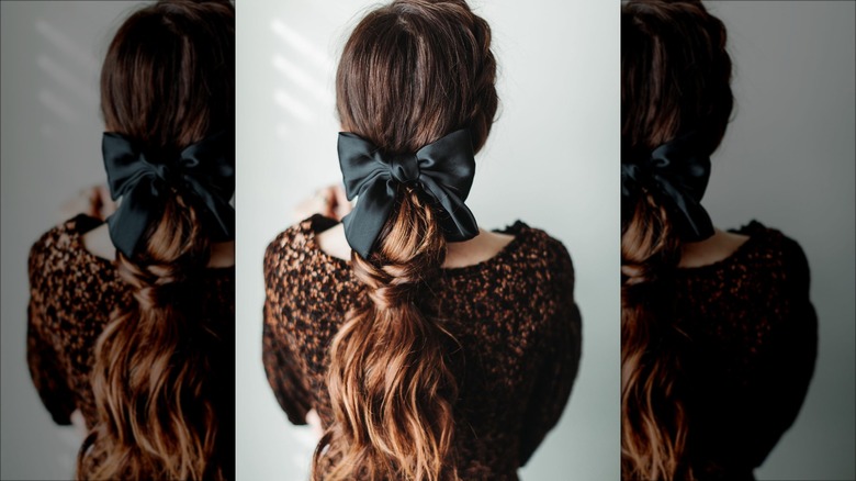 woman wearing big black hair bow