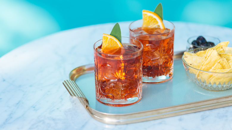 Two Negroni cocktails on a tray