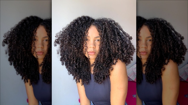 woman with short layered curly bob