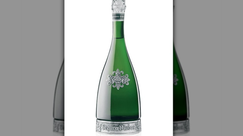 Silver and green wine bottle
