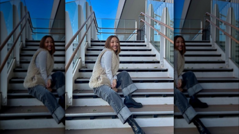 A woman wearing cuffed baggy jeans