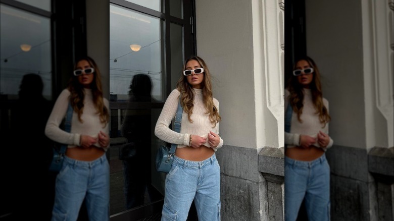 A woman wearing low-rise baggy jeans