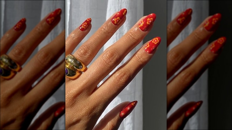 Red nails with fall flowers