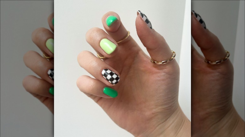 woman with green and checkered nails