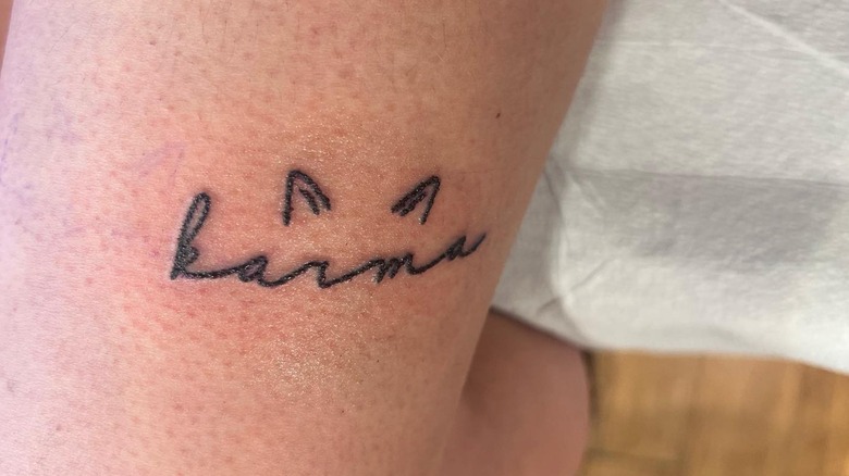 Karma is a cat tattoo