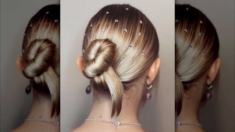 Asymmetrical chignon style with hair gems