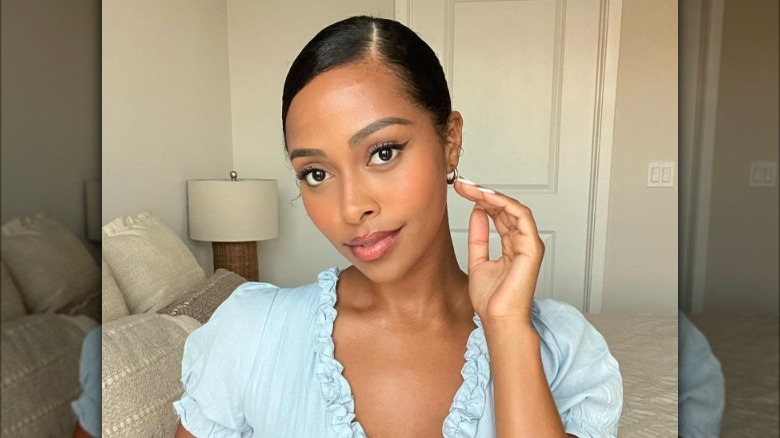 Sleek side part bun hairstyle