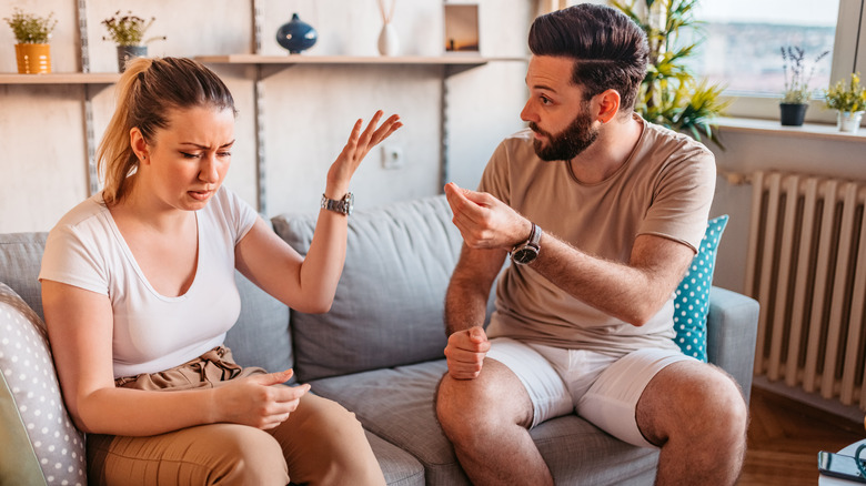 A couple having a disagreement with the woman invalidating the man's concerns