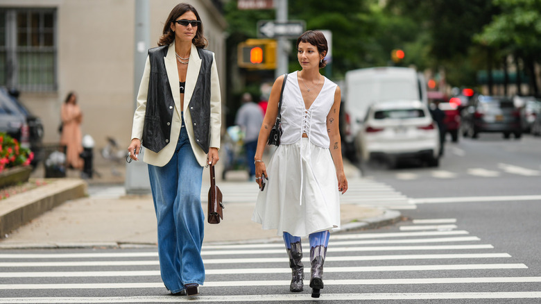 Two people walking in boots
