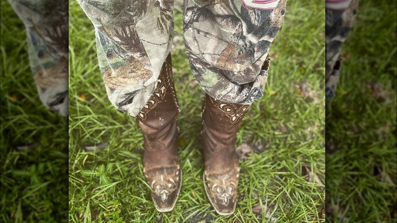Camo sweatpants and cowboy boots