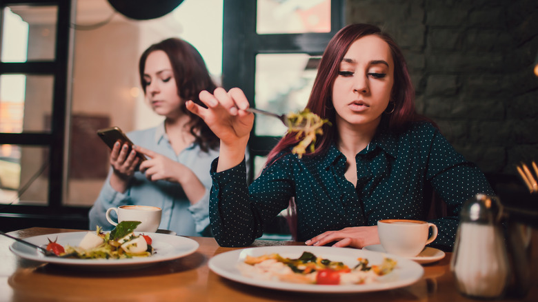 Bored looking couple at dinner
