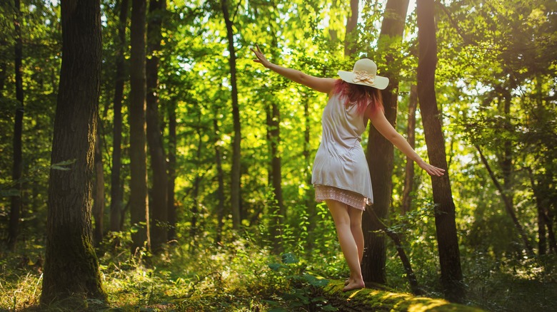 Woman walking in woods
