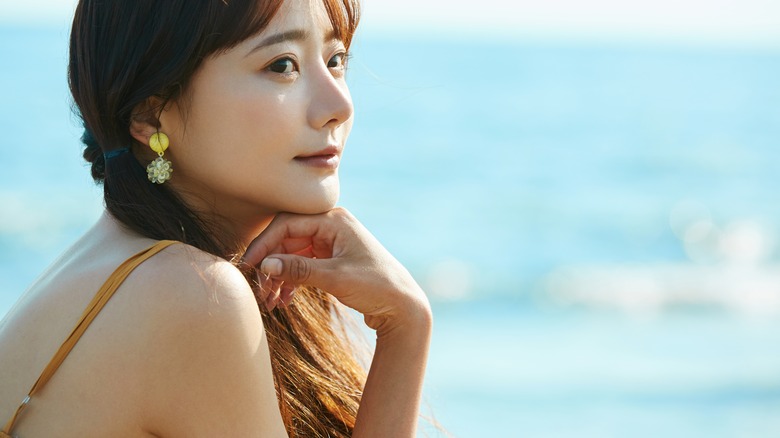 Thoughtful woman at seaside 