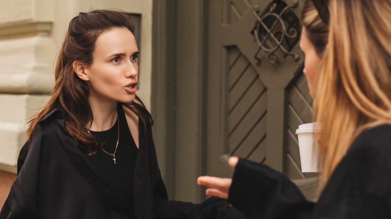 Angry woman yells at a friend