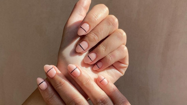 nude manicure with black line