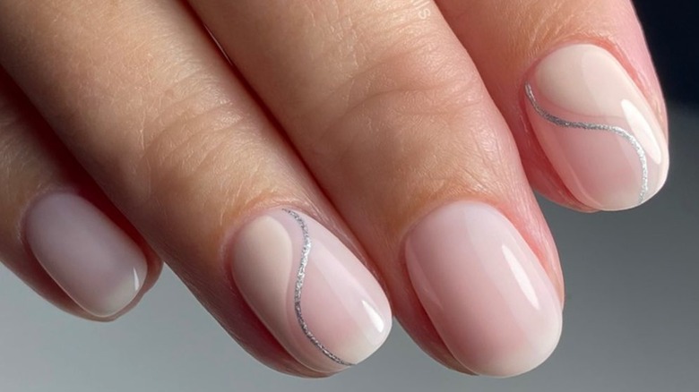 neutral manicure with glitter swirl