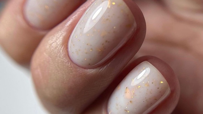 golf flakes on white nail polish