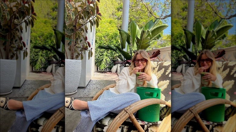 Girl drinking matcha next to rubber bonsai bag.