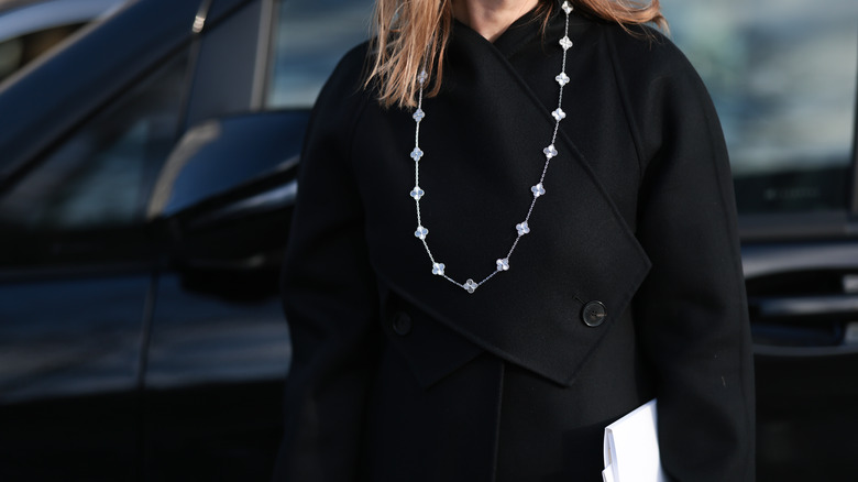 Woman wearing long chain necklace