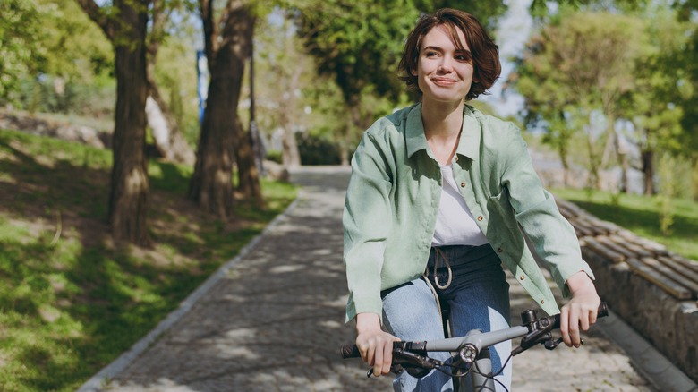 woman biking in park