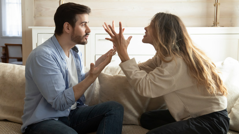 Man and woman fighting