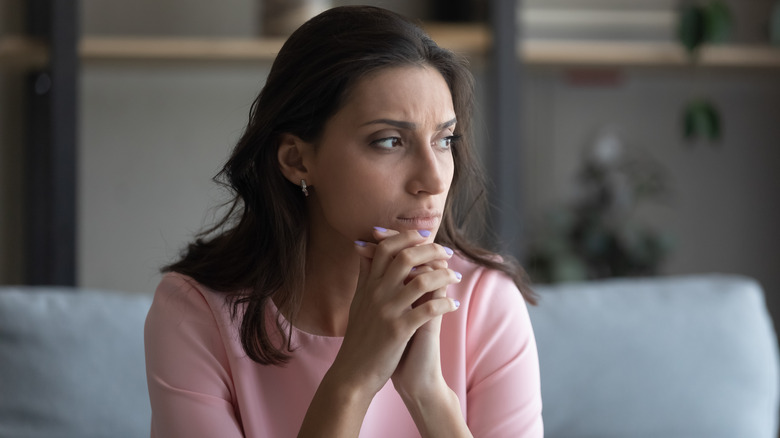 Concerned woman thinking