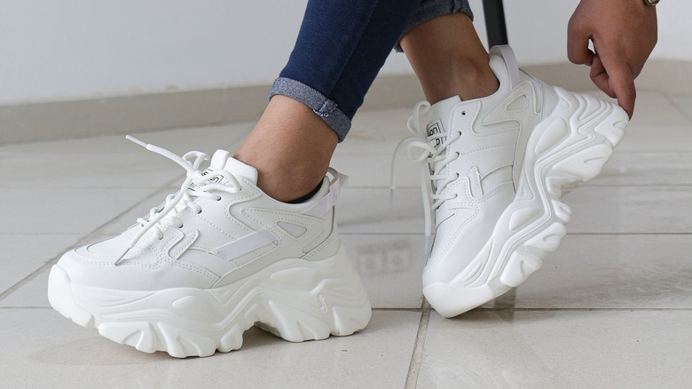 woman wearing chunky sports shoes