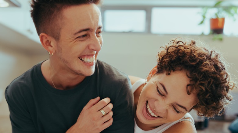 LGBTQ+ couple laughing together