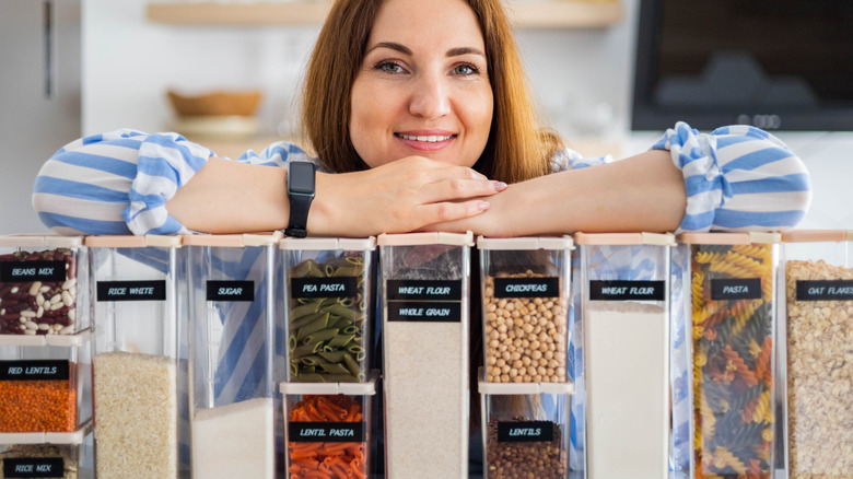 woman holding organized kitchen goods