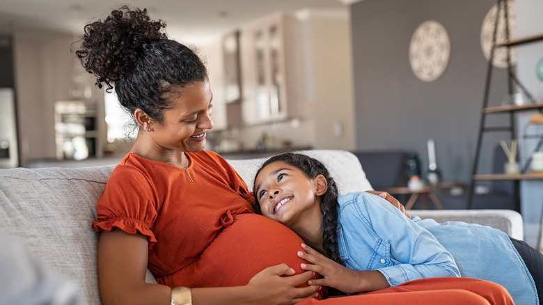 Pregnant woman with child