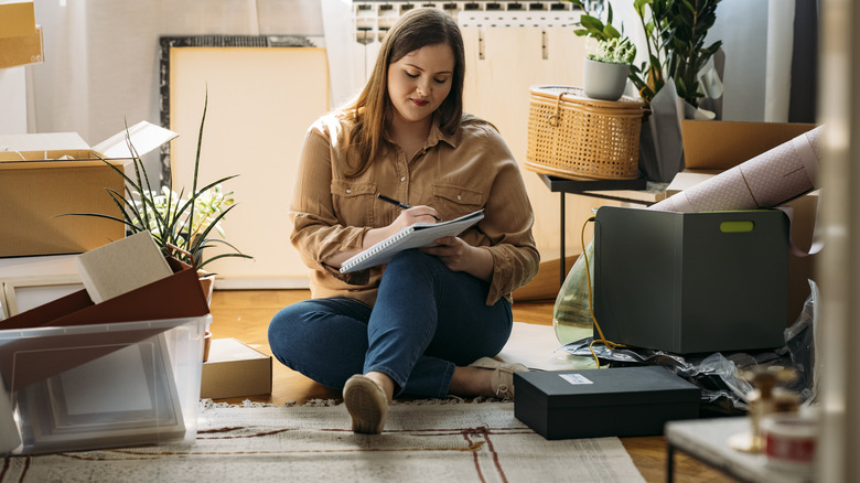 woman checking off list 