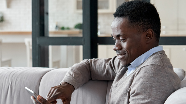 man reading his phone