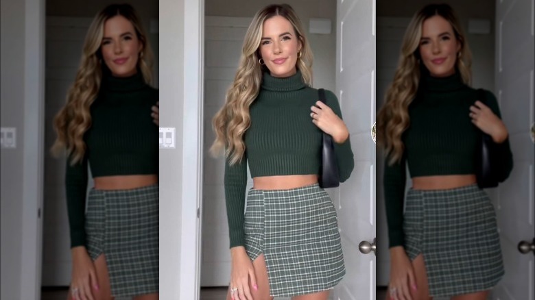 Screenshot showing form fitting sweater and miniskirt