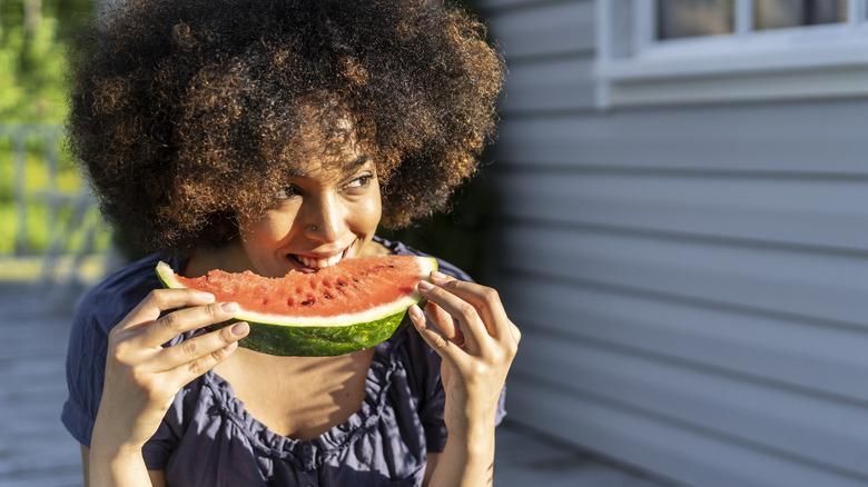 Woman eating watermelon
