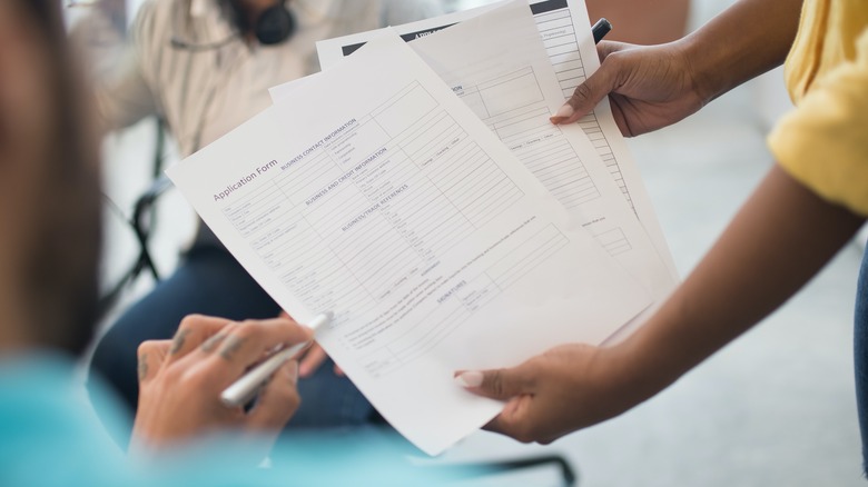 colleagues checking documents