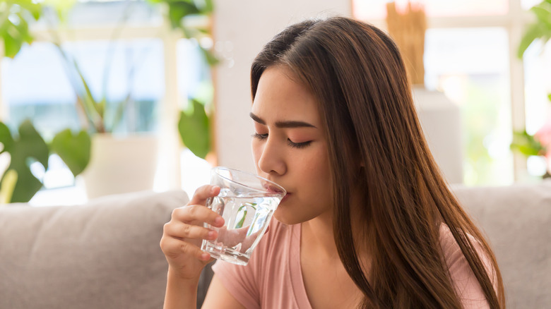 woman taking ibuprofen